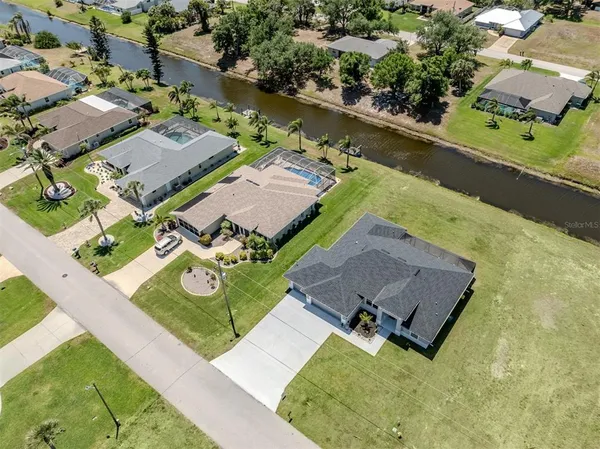 an aerial view of residential building and car parked