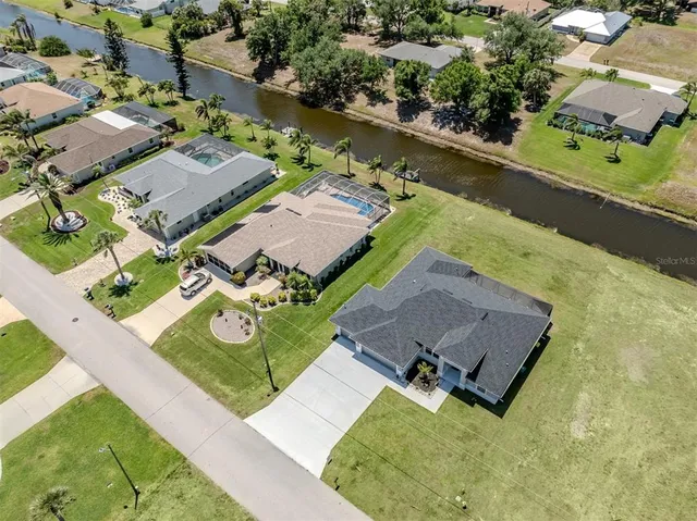 an aerial view of residential building and car parked
