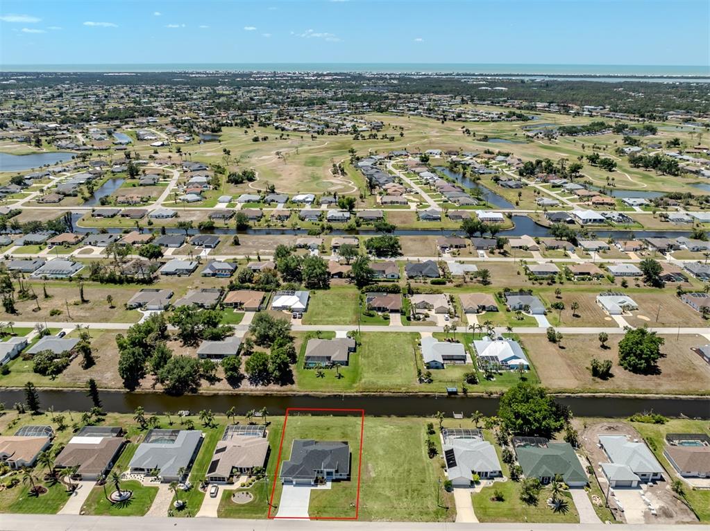 65 Fairway Road Rotonda West, FL 33947 - Photo 34 of 40 an aerial view of residential building and car parked