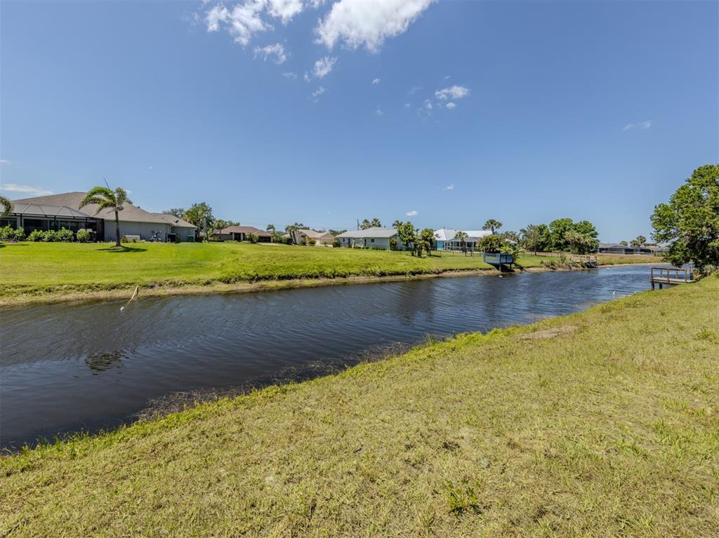 65 Fairway Road Rotonda West, FL 33947 - Photo 5 of 40 a view of an ocean and city