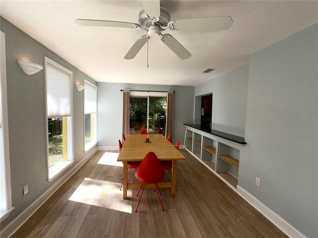 1883 Riviera Circle Sarasota, FL 34232 - Photo 15 of 45 a view of a dining room with furniture window and wooden floor