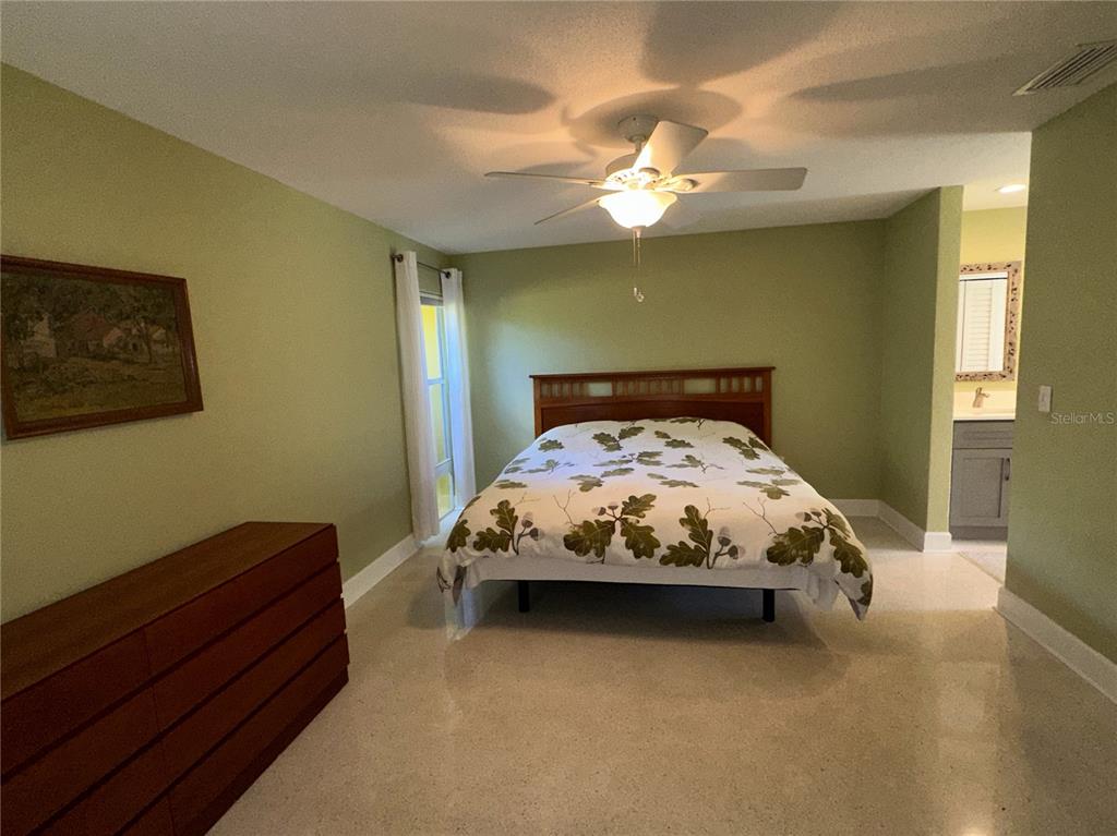 1883 Riviera Circle Sarasota, FL 34232 - Photo 16 of 45 a bed sitting in a bedroom next to a window