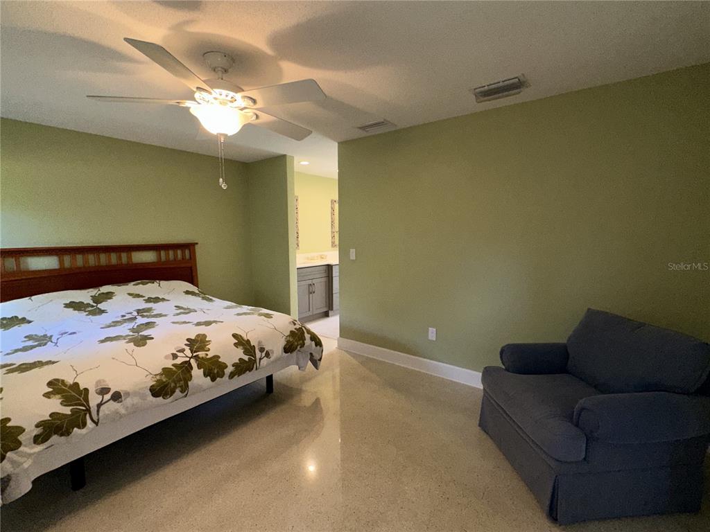 1883 Riviera Circle Sarasota, FL 34232 - Photo 17 of 45 a bedroom with a bed couch and window