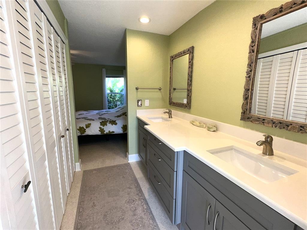 1883 Riviera Circle Sarasota, FL 34232 - Photo 20 of 45 a bathroom with a double vanity sink and mirror