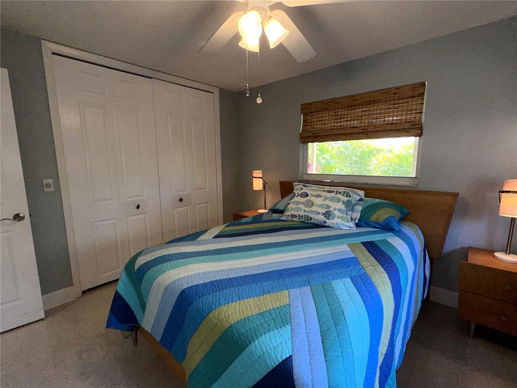 1883 Riviera Circle Sarasota, FL 34232 - Photo 28 of 45 a bedroom with a bed and a window