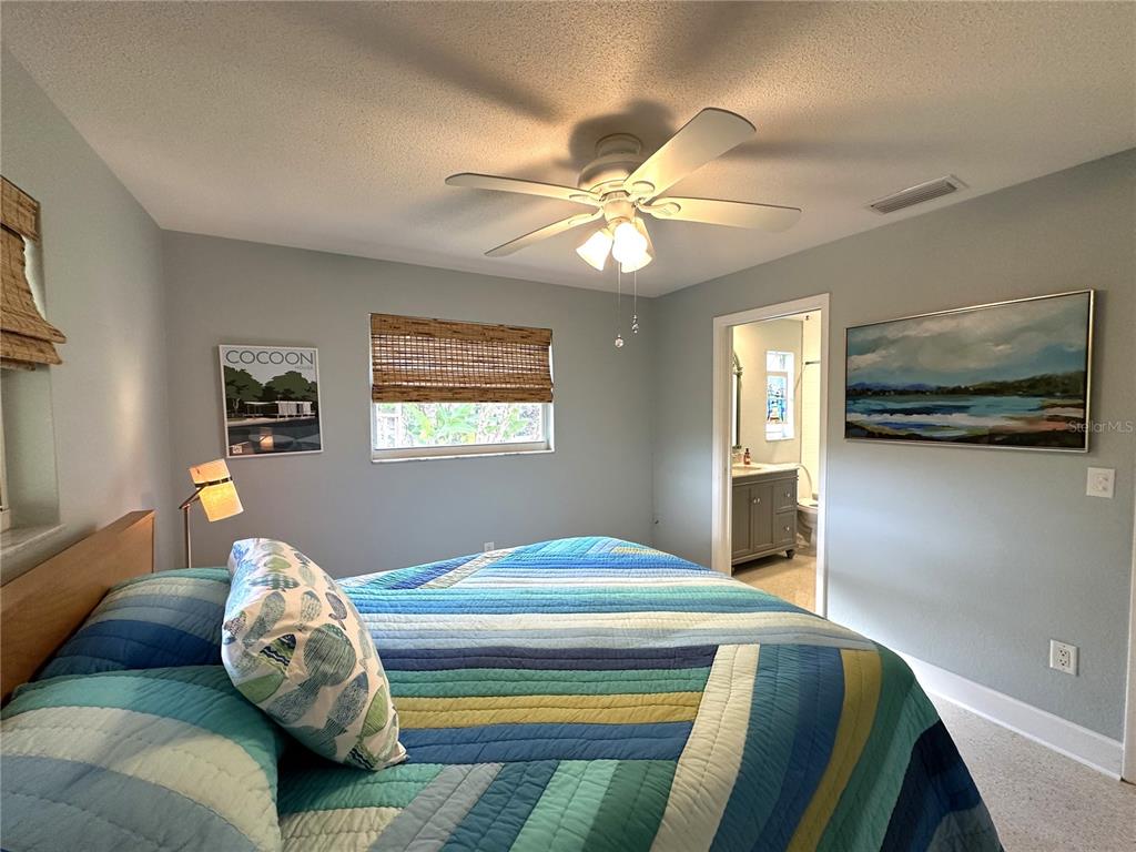 1883 Riviera Circle Sarasota, FL 34232 - Photo 31 of 45 a bedroom with a bed and window
