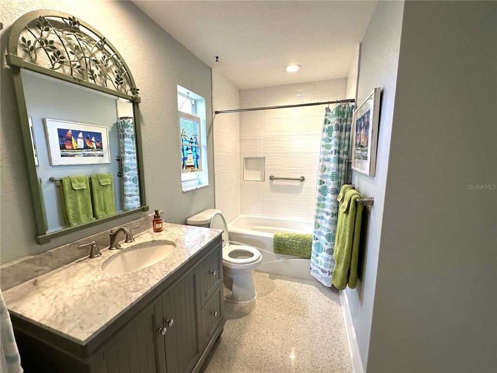 1883 Riviera Circle Sarasota, FL 34232 - Photo 35 of 45 a bathroom with a granite countertop sink and a mirror