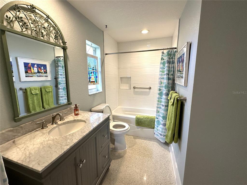 1883 Riviera Circle Sarasota, FL 34232 - Photo 36 of 45 a bathroom with a granite countertop sink and a mirror