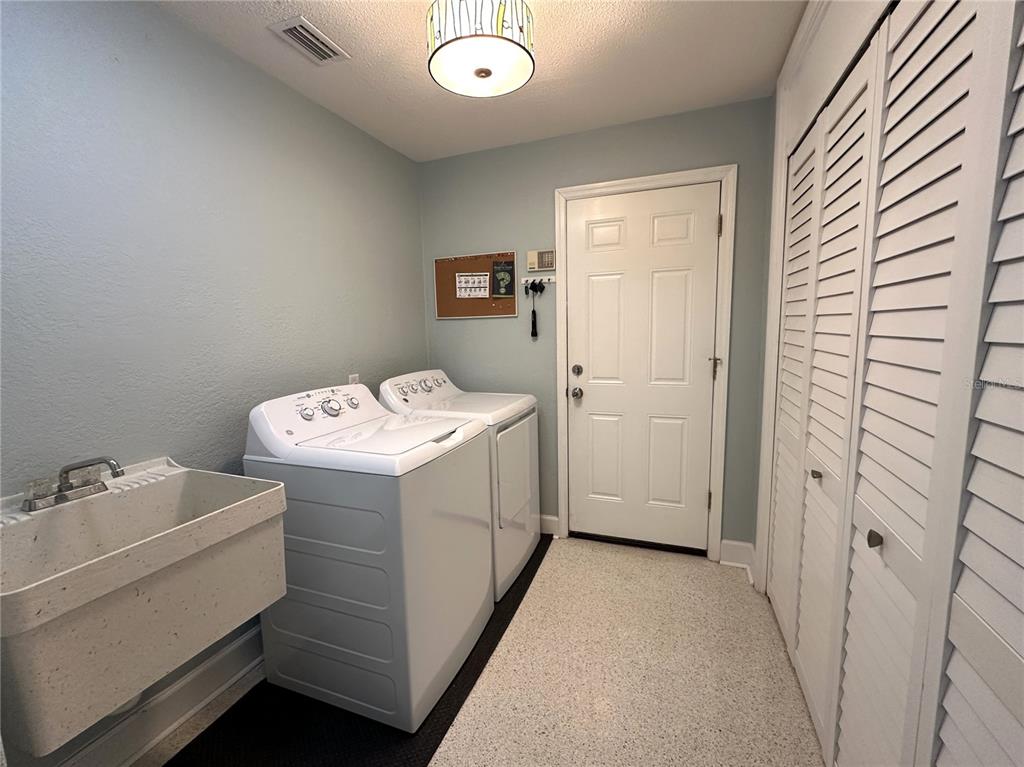 1883 Riviera Circle Sarasota, FL 34232 - Photo 37 of 45 a utility room with dryer and washer