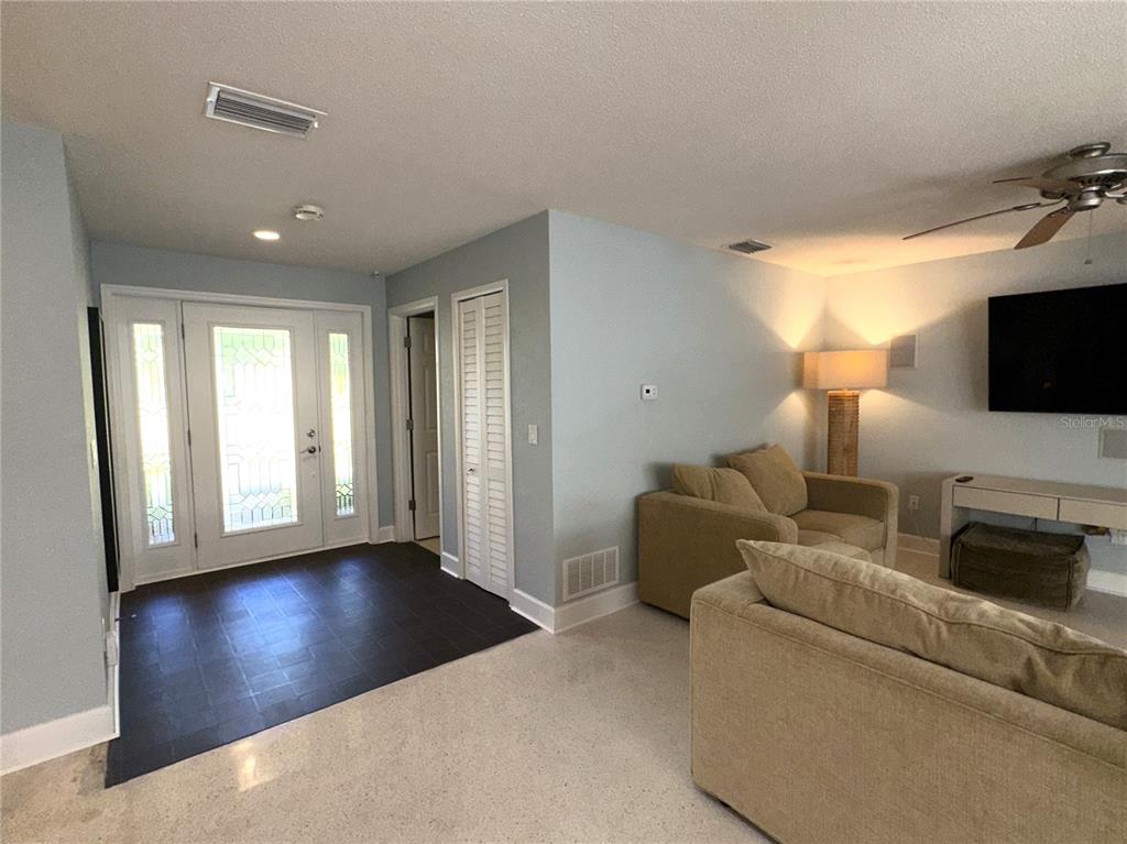 1883 Riviera Circle Sarasota, FL 34232 - Photo 9 of 45 a living room with furniture and a flat screen tv