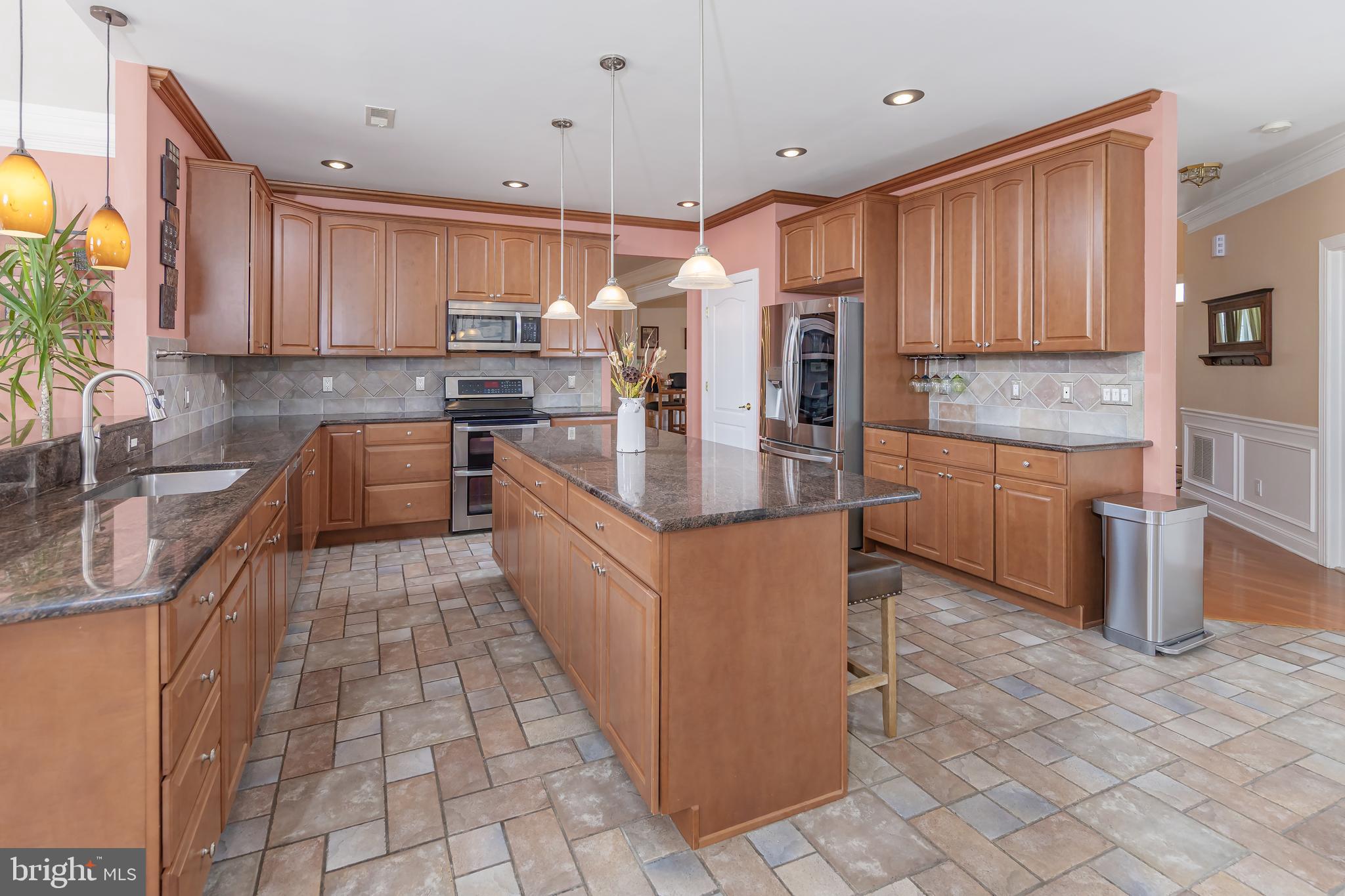 612 Bainbridge Drive Mullica Hill, NJ 08062 - Photo 11 of 42 a large kitchen with stainless steel appliances granite countertop a stove a sink dishwasher and a refrigerator