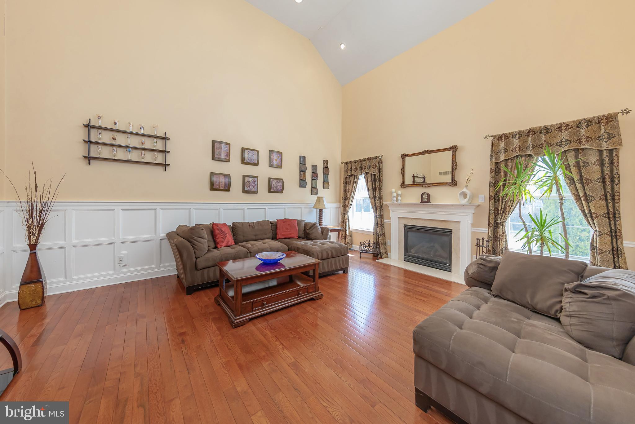 612 Bainbridge Drive Mullica Hill, NJ 08062 - Photo 15 of 42 a living room with furniture and a fireplace