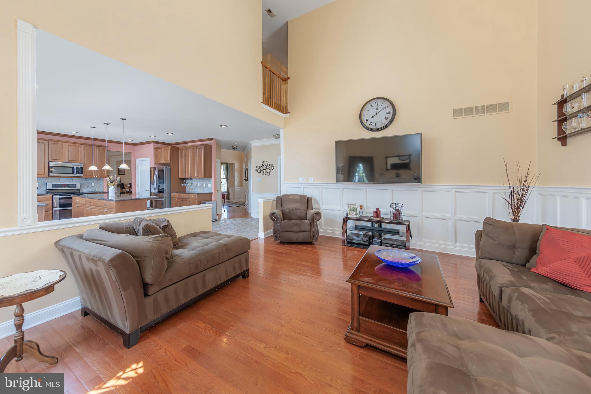 612 Bainbridge Drive Mullica Hill, NJ 08062 - Photo 16 of 42 a living room with furniture and a wooden floor