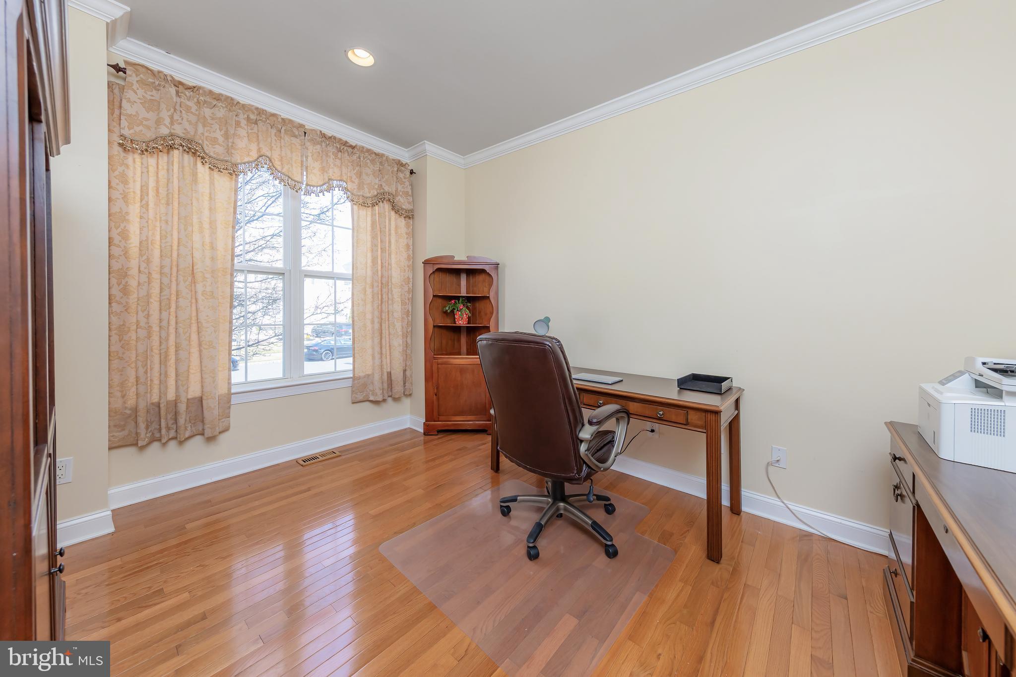 612 Bainbridge Drive Mullica Hill, NJ 08062 - Photo 17 of 42 a view of a workspace with furniture and a window