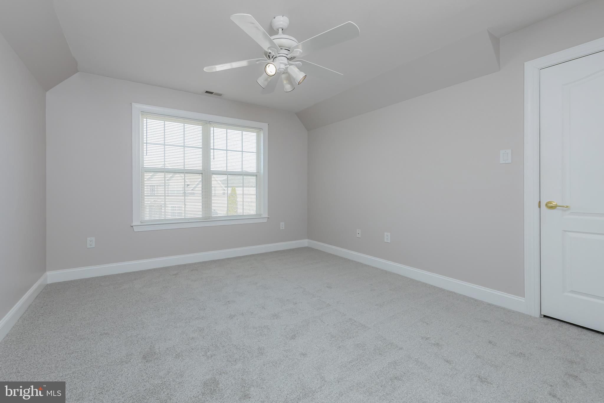 612 Bainbridge Drive Mullica Hill, NJ 08062 - Photo 26 of 42 an empty room with windows and ceiling fan
