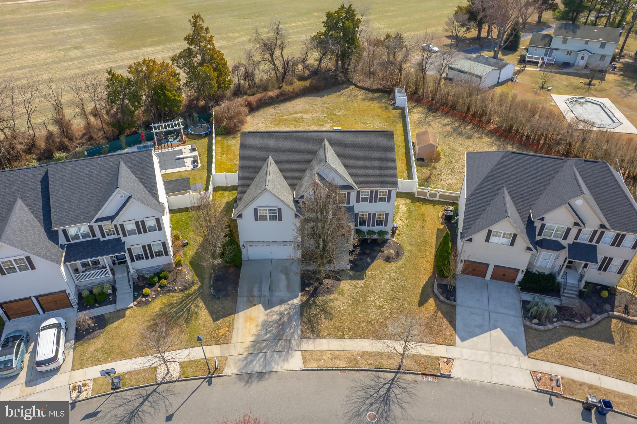 612 Bainbridge Drive Mullica Hill, NJ 08062 - Photo 37 of 42 an aerial view of a house with a swimming pool