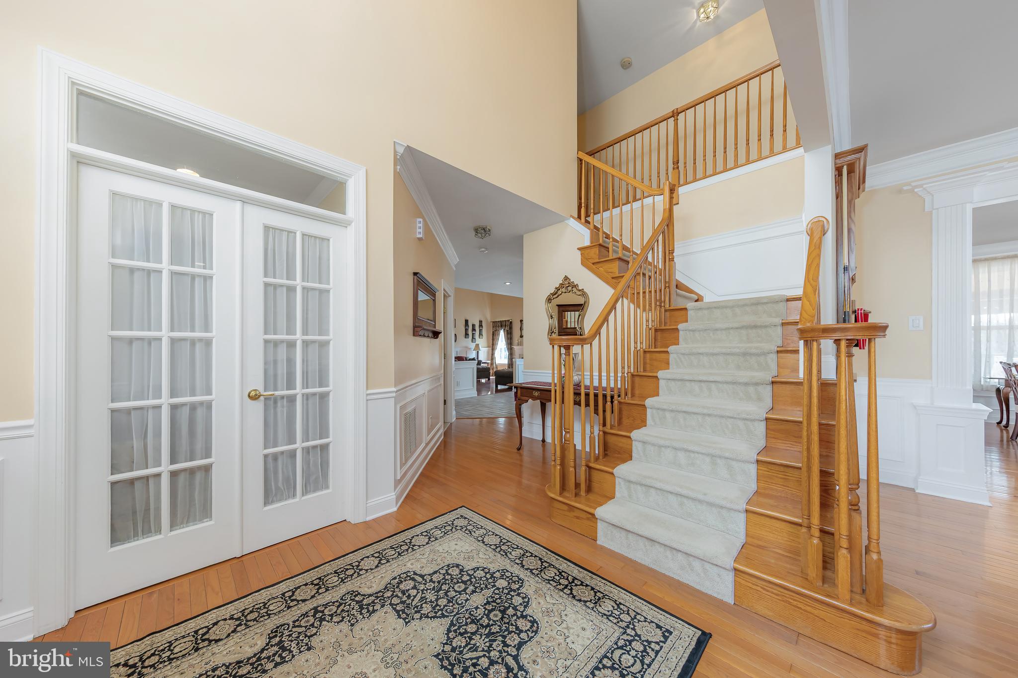 612 Bainbridge Drive Mullica Hill, NJ 08062 - Photo 5 of 42 a view of entryway and hall with wooden floor