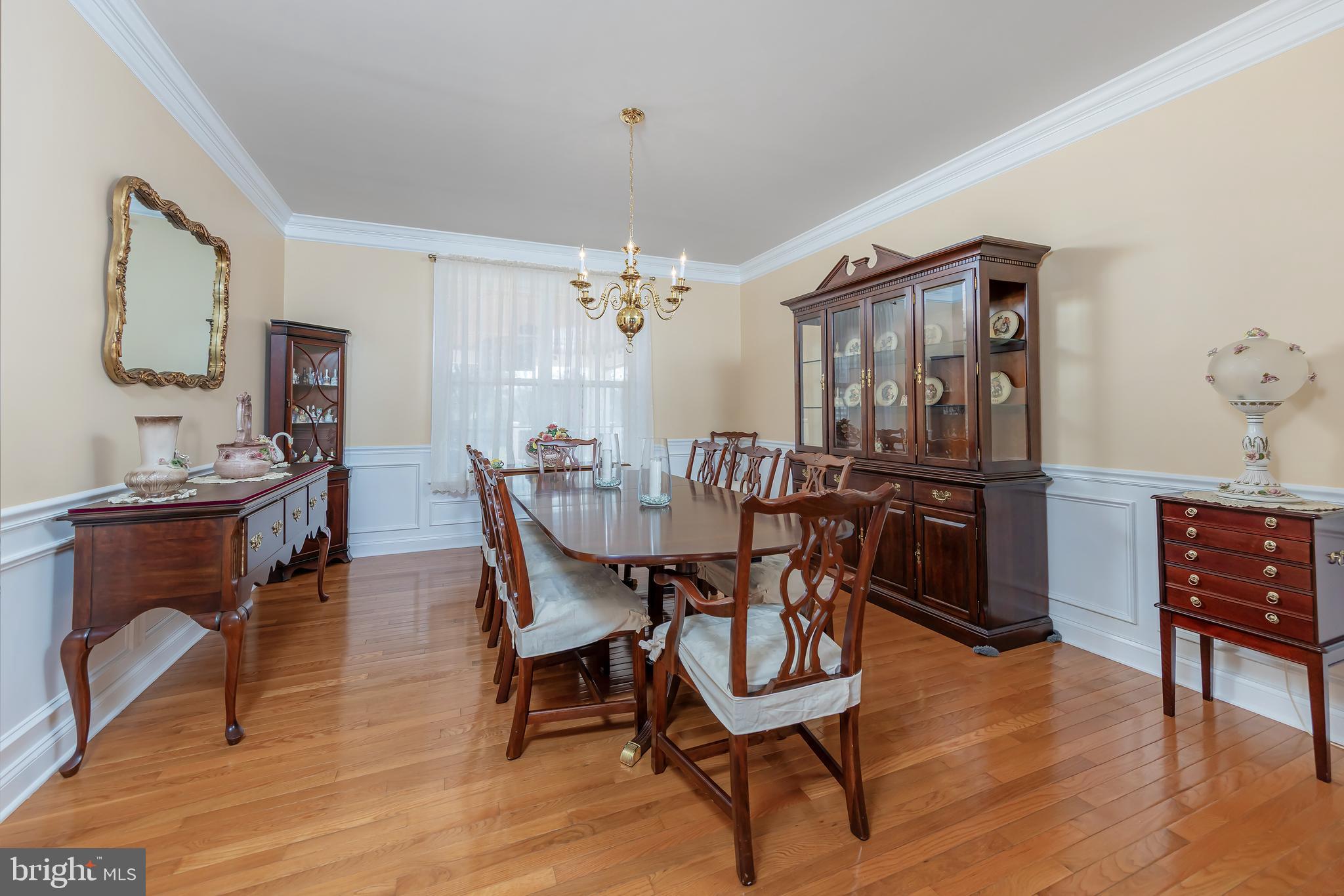 612 Bainbridge Drive Mullica Hill, NJ 08062 - Photo 8 of 42 a view of a dining room with furniture and wooden floor