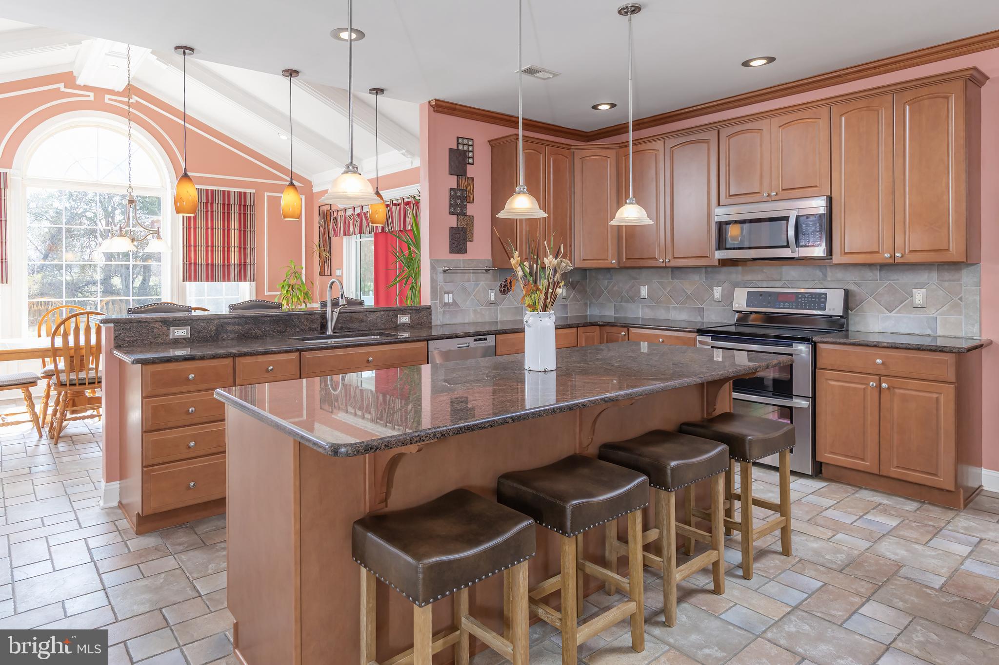 612 Bainbridge Drive Mullica Hill, NJ 08062 - Photo 10 of 42 a kitchen with granite countertop a sink a counter top space appliances and cabinets