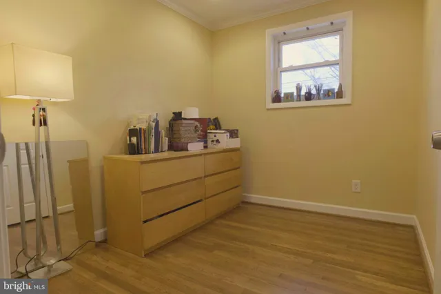 a room with a bed and a lamp on table