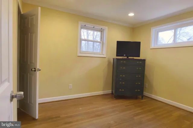wooden floor and window in an empty room