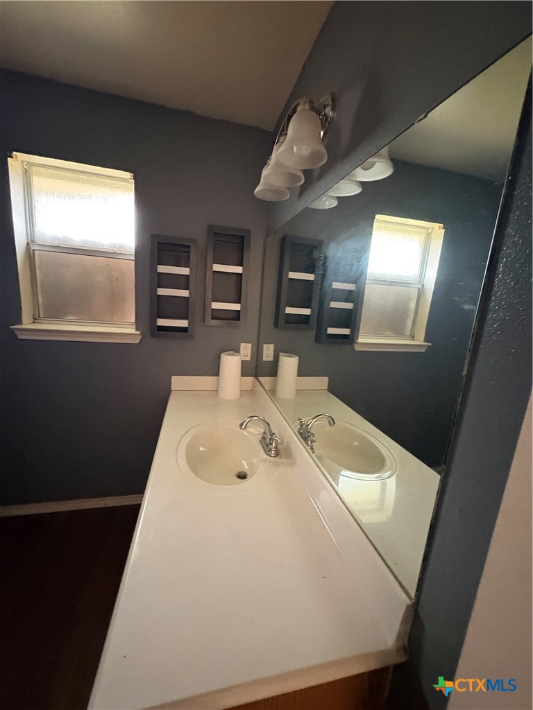 206 Timber Ridge Drive Nolanville, TX 76559 - Photo 10 of 21 a en suite bathroom with a sink and mirror