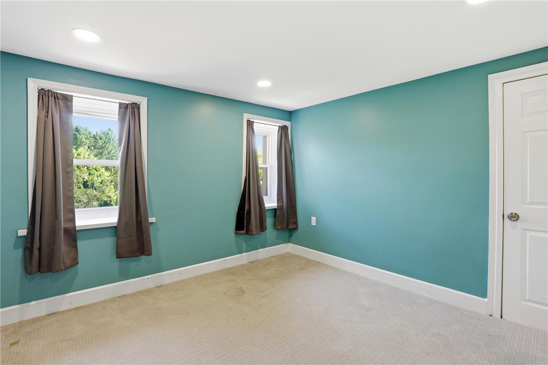 6271 Batman Road Zionsville, PA 18092 - Photo 58 of 100 Recessed lighting illuminates this inviting bedroom, featuring two windows with abundant natural light.