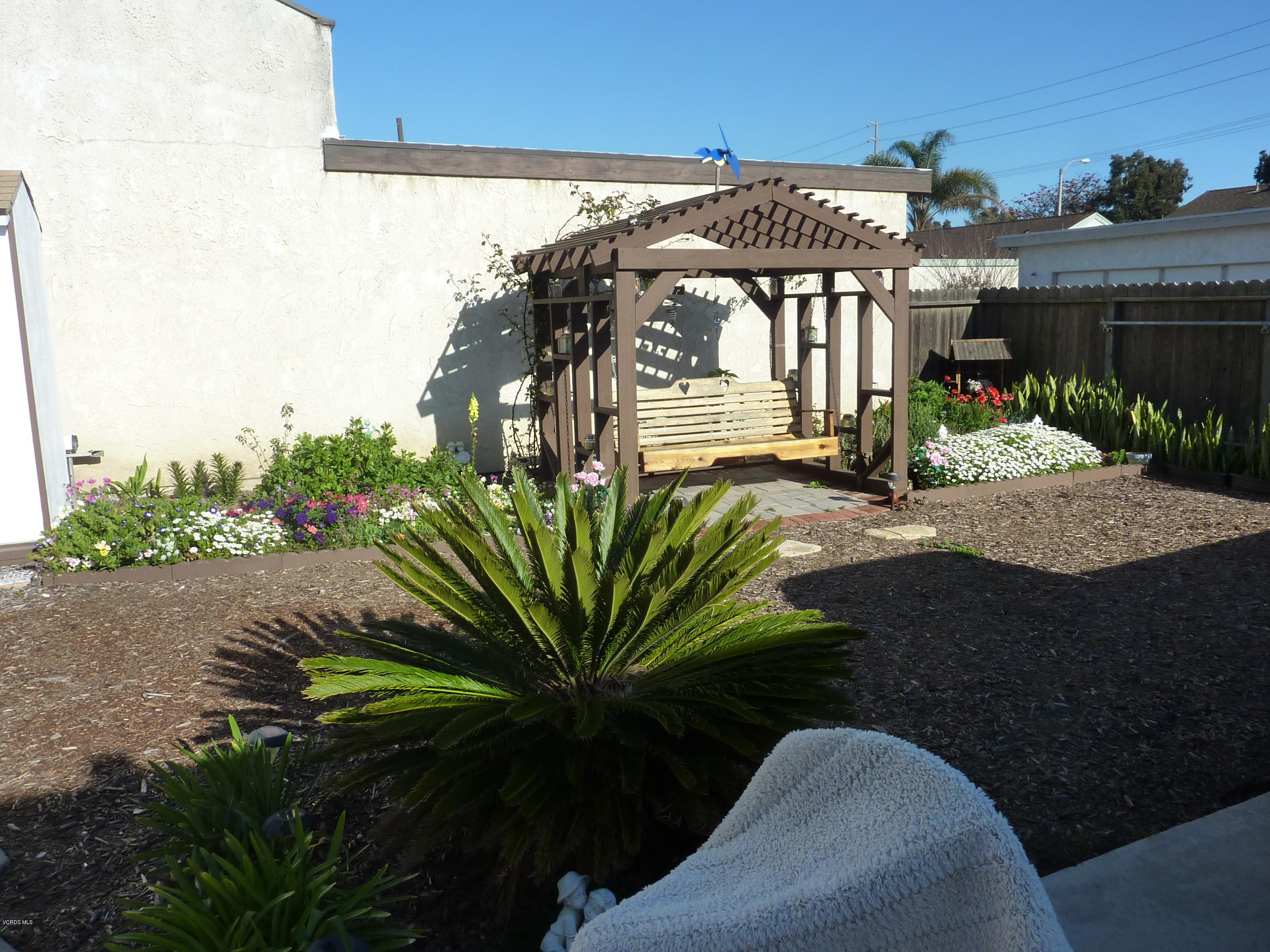 3310 Isle Way Oxnard, CA 93035 - Photo 1 of 1 a view of a house with backyard and sitting area