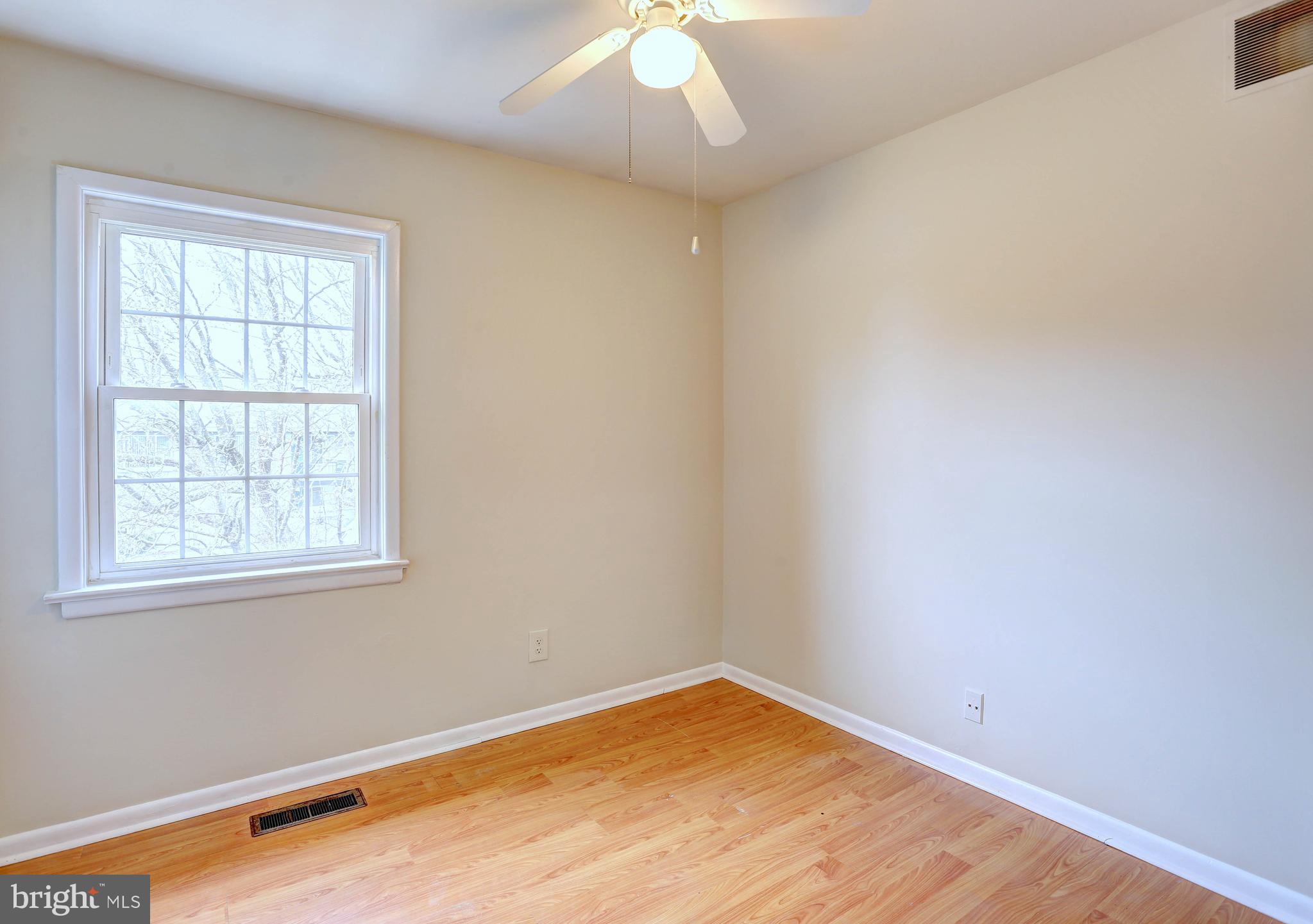 9110 Tumbleweed Run, Unit G Laurel, MD 20723 - Photo 12 of 32 an empty room with a window