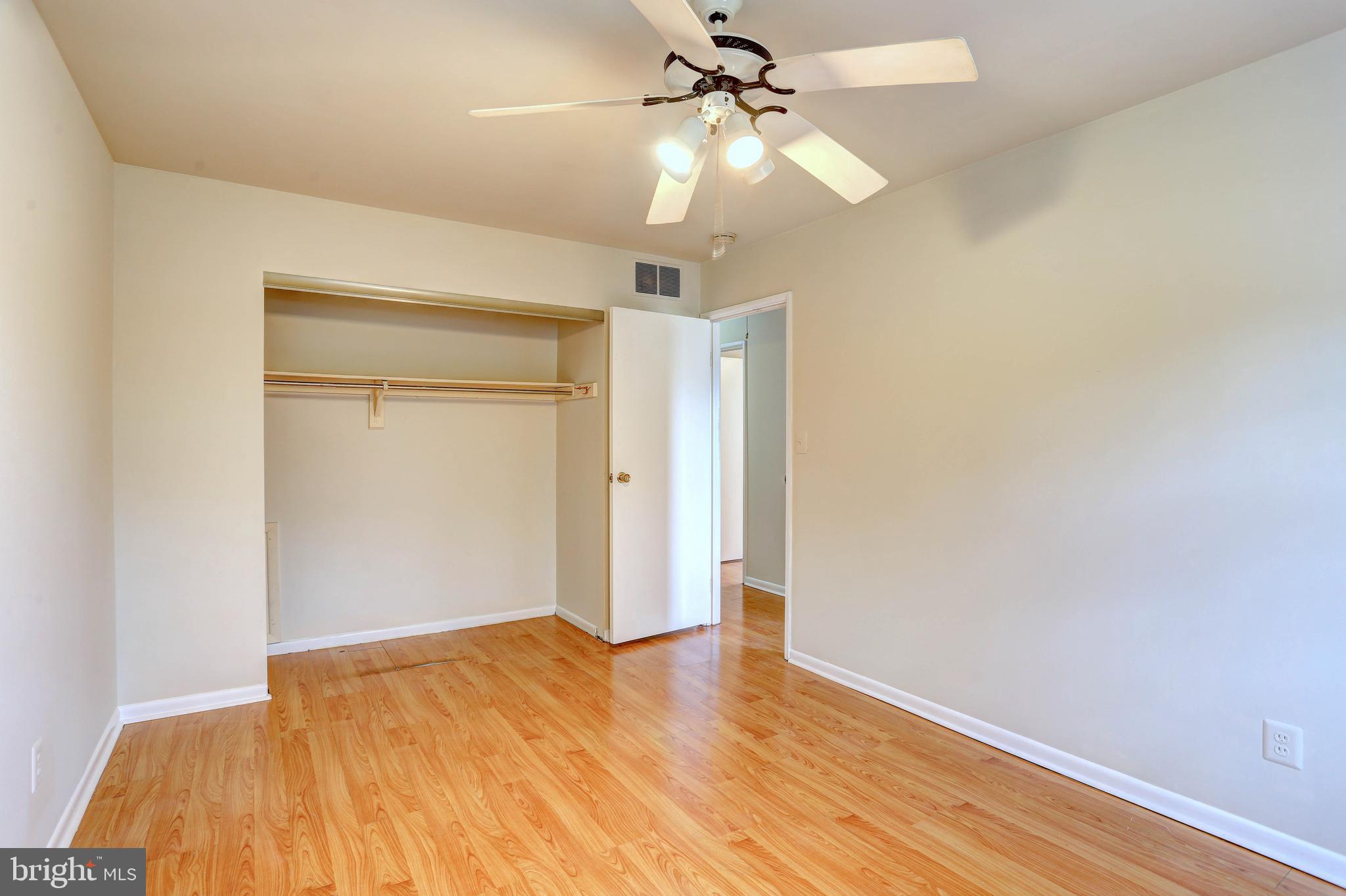 9110 Tumbleweed Run, Unit G Laurel, MD 20723 - Photo 15 of 32 a view of empty room with wooden floor