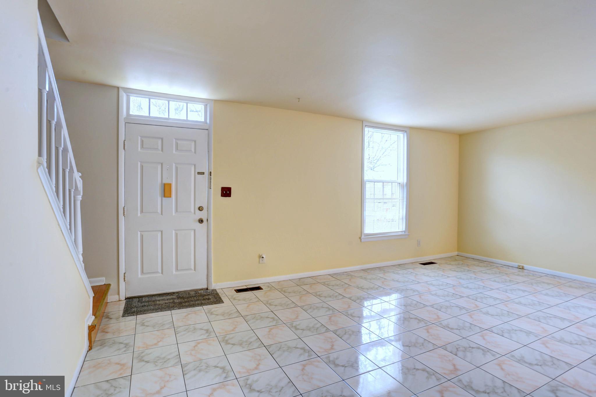 9110 Tumbleweed Run, Unit G Laurel, MD 20723 - Photo 2 of 32 wooden floor in an empty room with a window