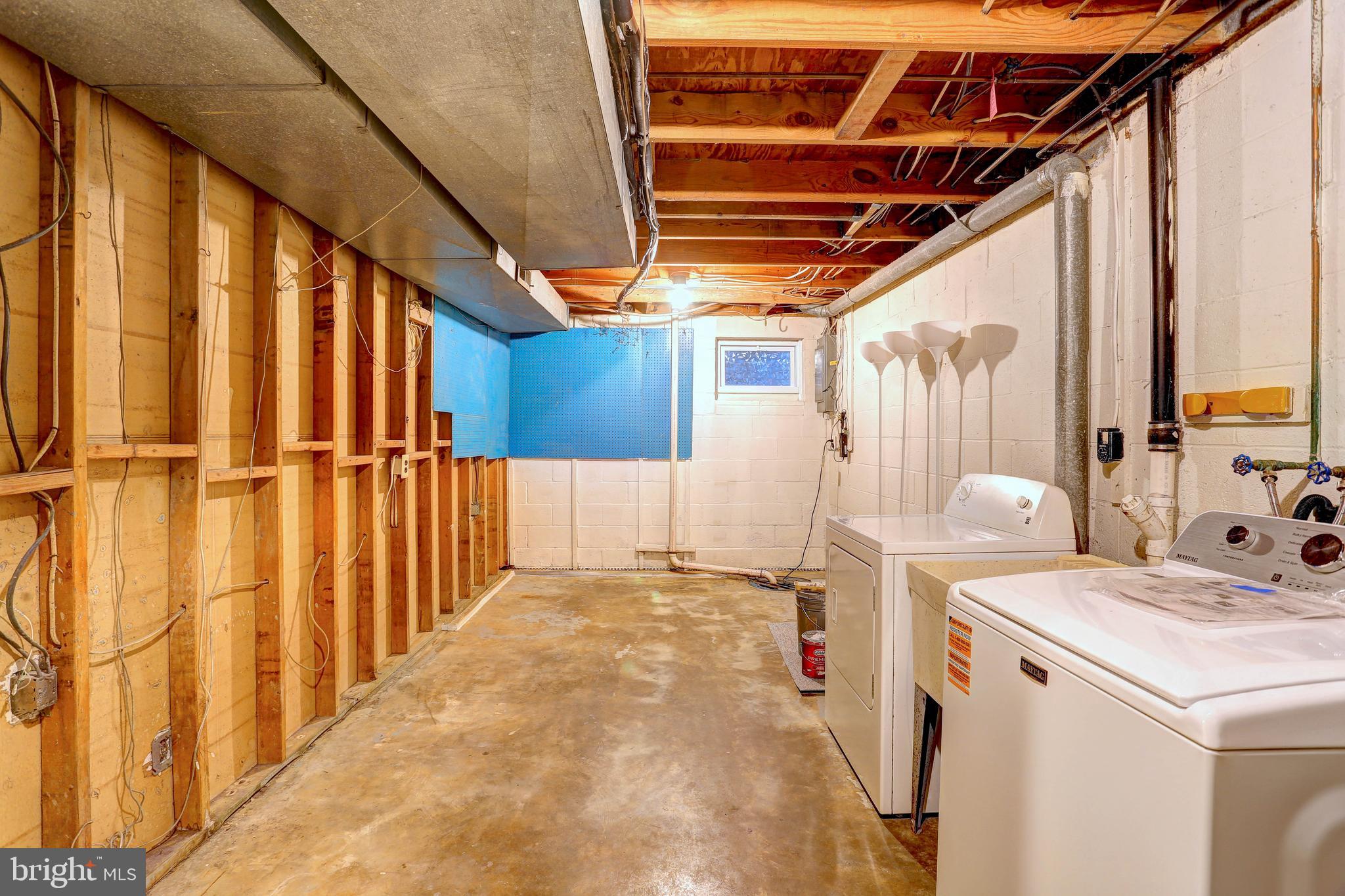 9110 Tumbleweed Run, Unit G Laurel, MD 20723 - Photo 21 of 32 a view of storage and utility room with washer and dryer