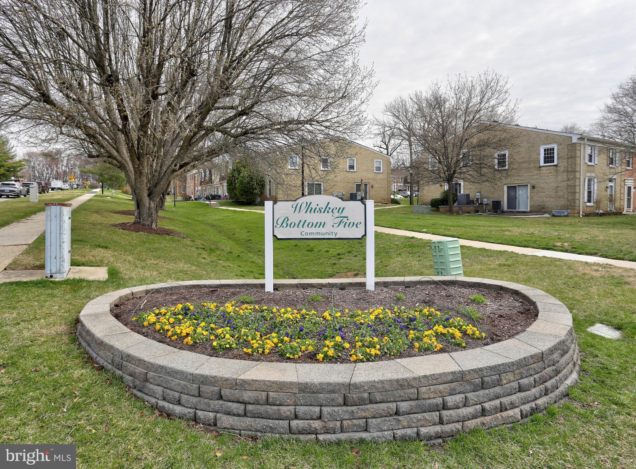 9110 Tumbleweed Run, Unit G Laurel, MD 20723 - Photo 23 of 32 a view of a swimming pool with a garden