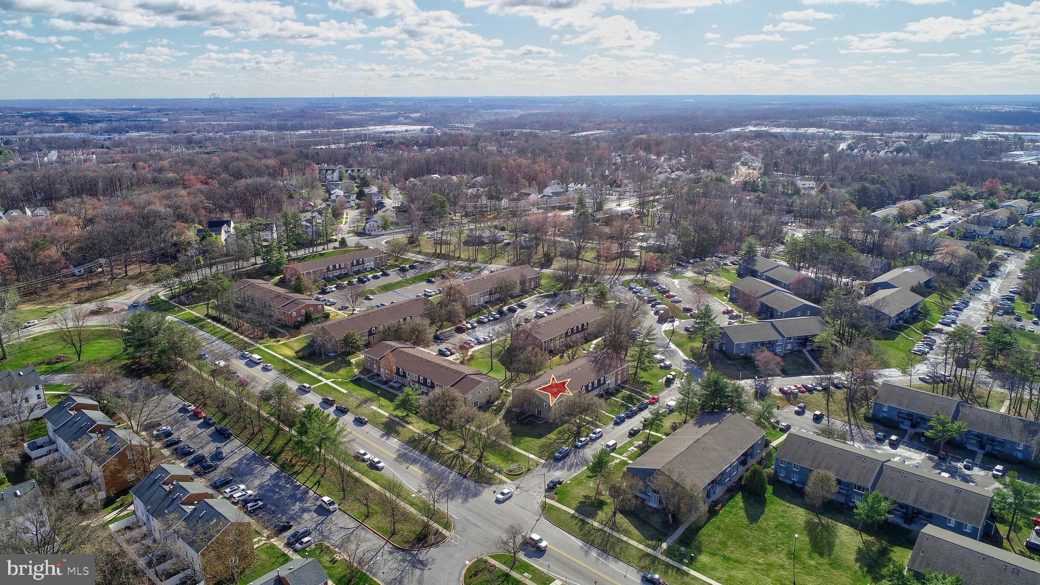 9110 Tumbleweed Run, Unit G Laurel, MD 20723 - Photo 24 of 32 an aerial view of residential houses with outdoor space