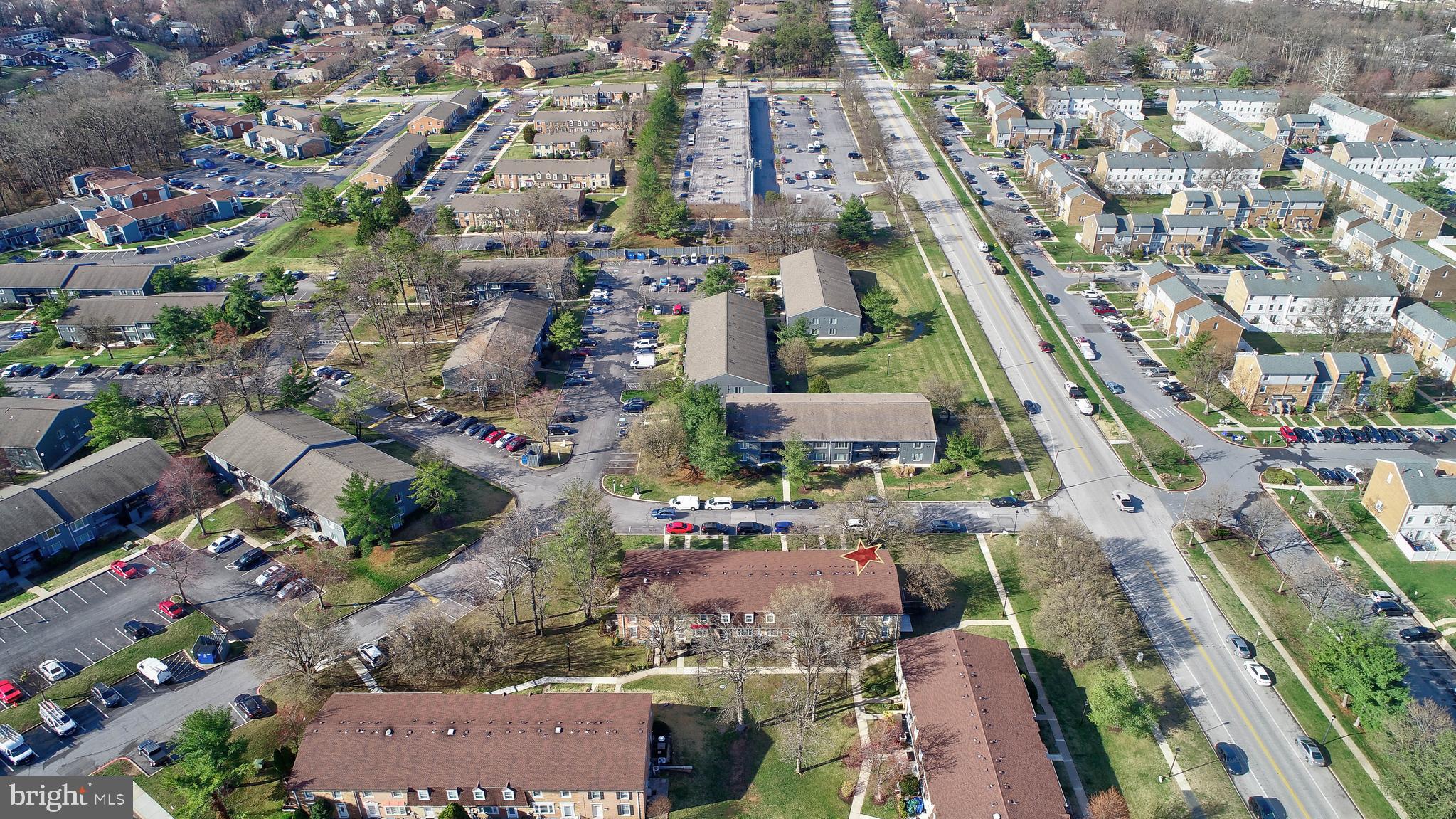 9110 Tumbleweed Run, Unit G Laurel, MD 20723 - Photo 27 of 32 an aerial view of residential houses with outdoor space