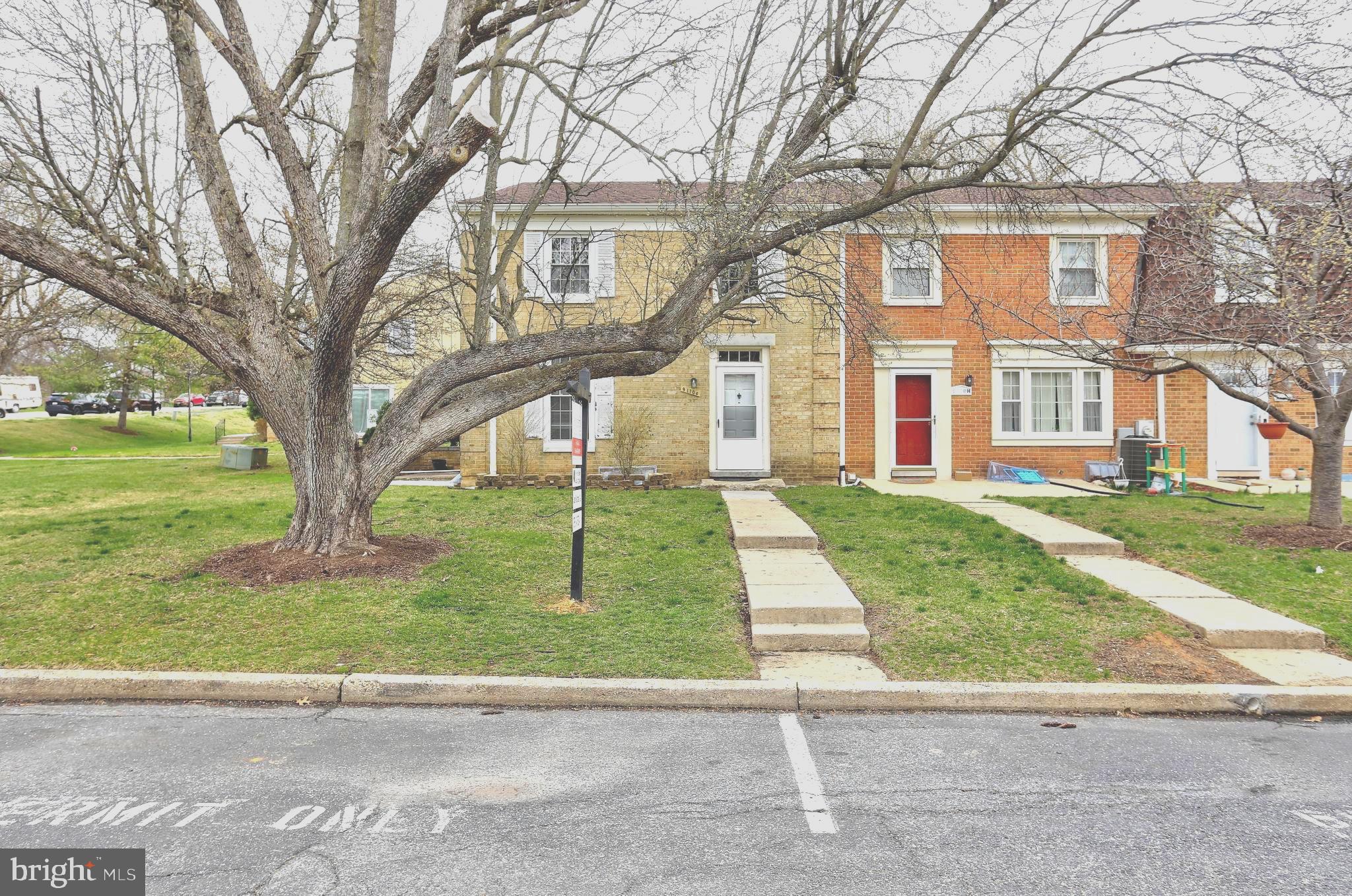 9110 Tumbleweed Run, Unit G Laurel, MD 20723 - Photo 29 of 32 front view of house with a yard