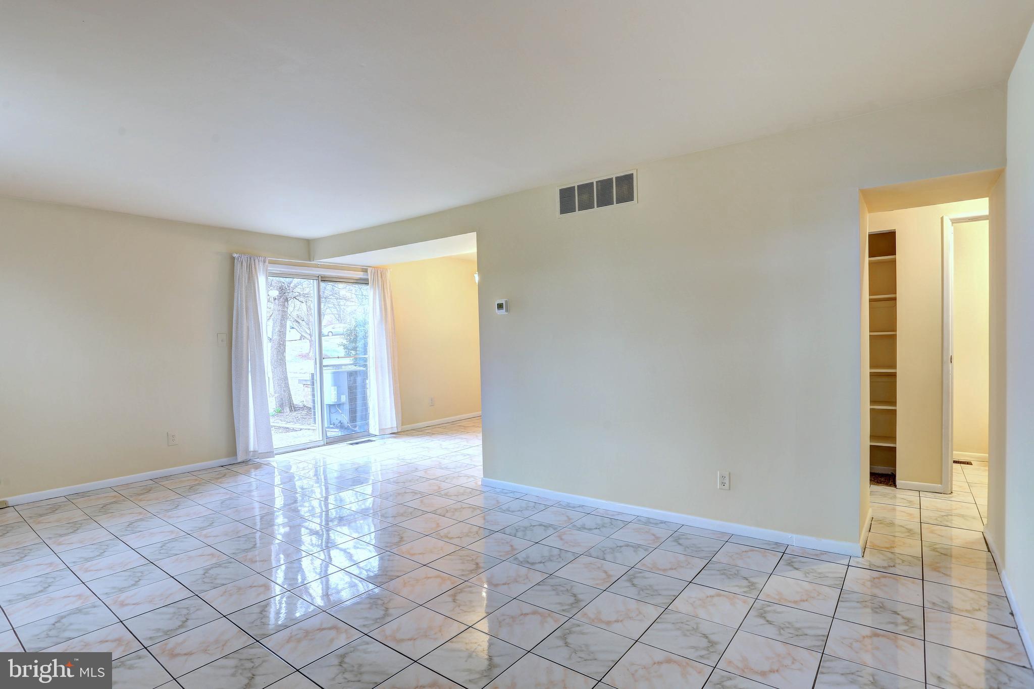 9110 Tumbleweed Run, Unit G Laurel, MD 20723 - Photo 3 of 32 a view of an empty room and window