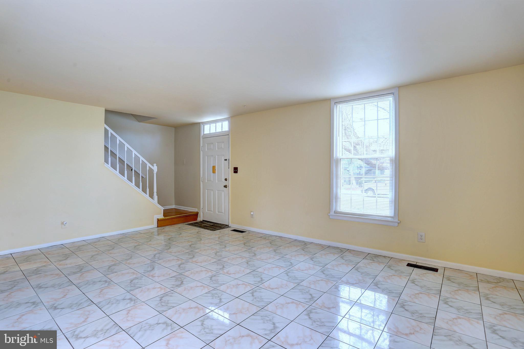 9110 Tumbleweed Run, Unit G Laurel, MD 20723 - Photo 5 of 32 a view of an empty room with a window