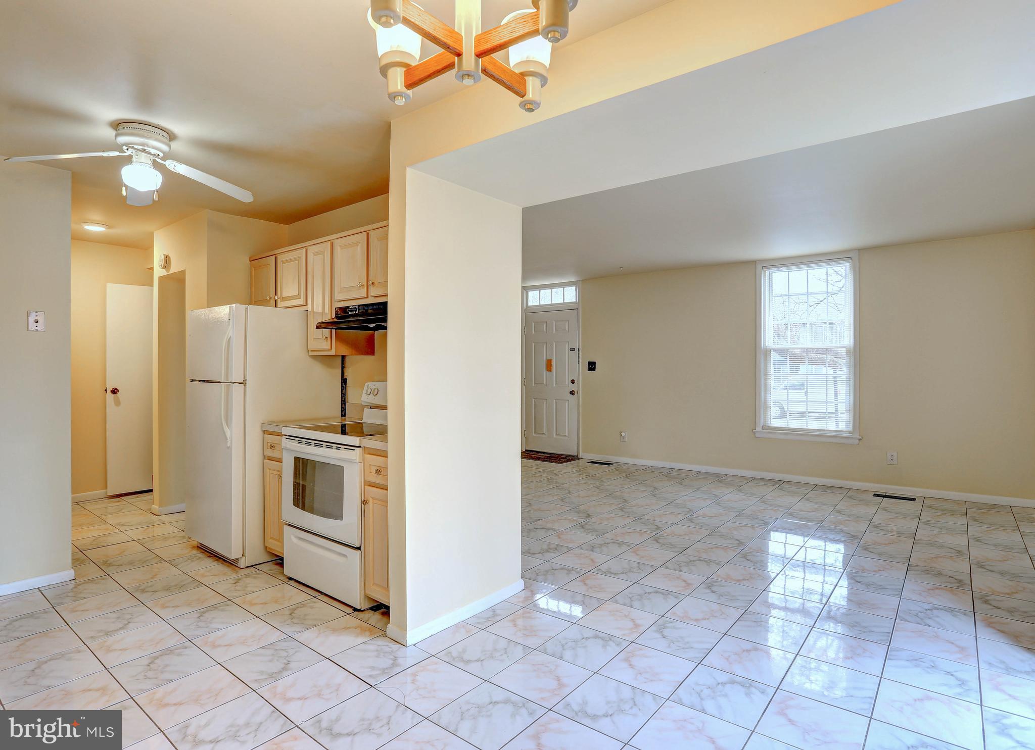 9110 Tumbleweed Run, Unit G Laurel, MD 20723 - Photo 6 of 32 a view of a kitchen with a sink