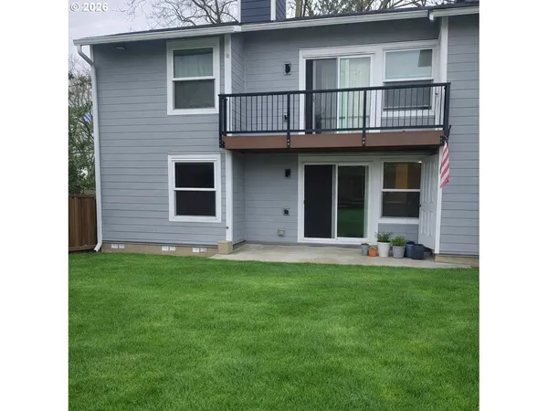 a view of a room with a white wall