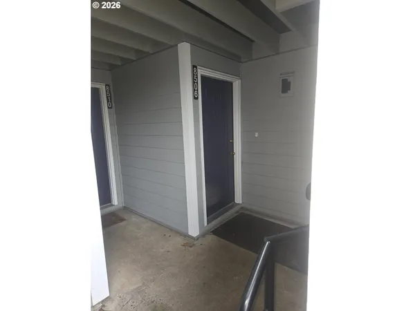 a view of a house with a yard and sitting space