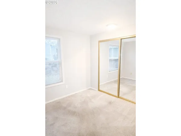 a view of a hallway with a white walls