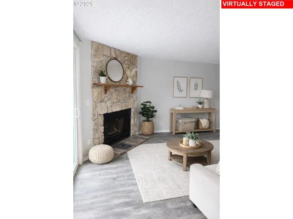 a view of an empty room with a fireplace