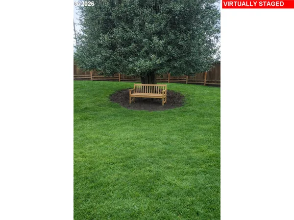 a kitchen with granite countertop a sink and a stove