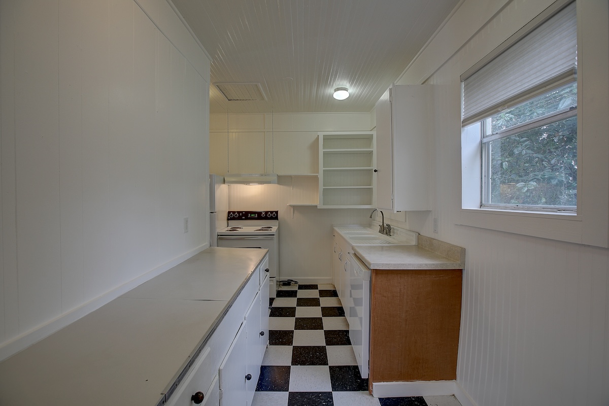 1708 Olive Street Georgetown, TX 78626 - Photo 39 of 40 a kitchen with a sink and a refrigerator