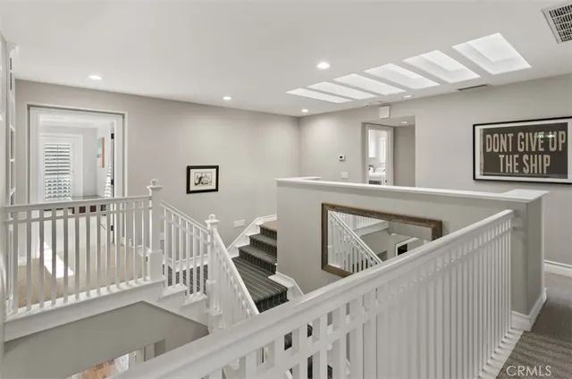 a view of a chairs and table in the balcony