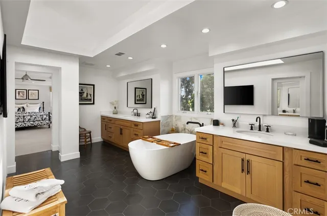 a bathroom with a mirror and a sink