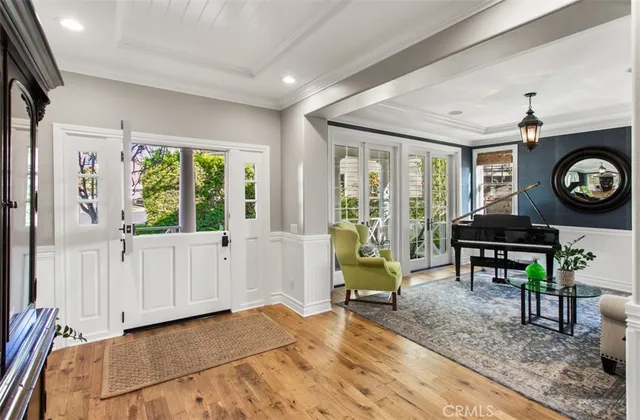 a view of a livingroom with furniture and a large window