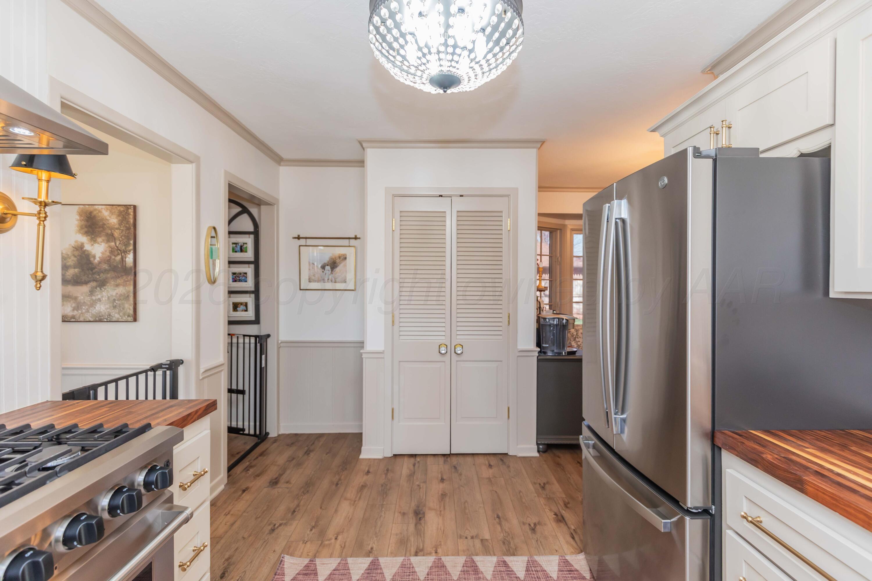 6308 Jameson Road Amarillo, TX 79106 - Photo 15 of 43 a view of kitchen with stainless steel appliances granite countertop a refrigerator and a stove top oven
