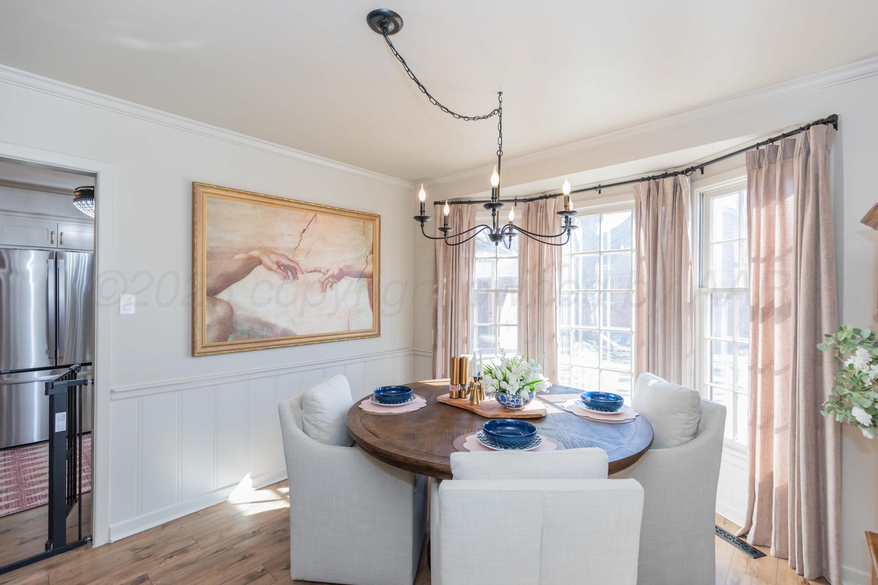 6308 Jameson Road Amarillo, TX 79106 - Photo 21 of 43 a view of a dining room with furniture window and wooden floor